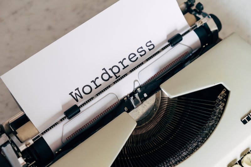 A vintage typewriter with WordPress text, representing content creation and text formatting challenges